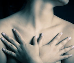 Woman with Hands Over Chest