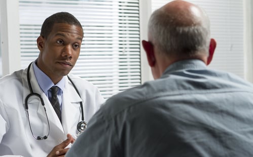 doctor consulting with senior patient