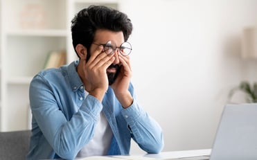 indian man rubbing eyes (1)