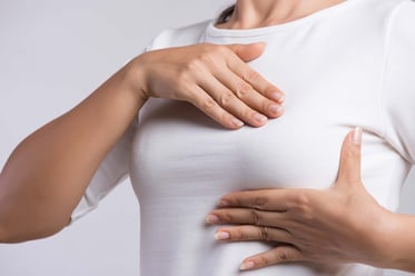 woman-examining-breast